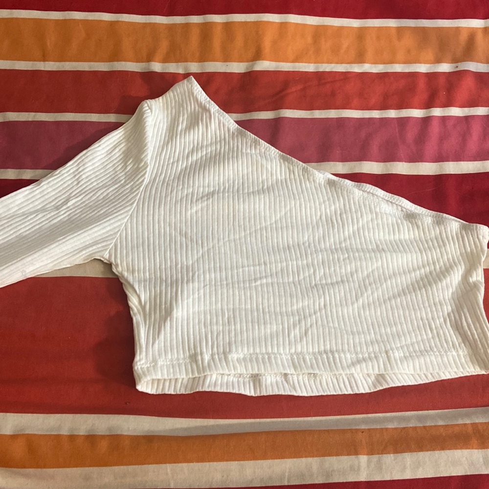 one shoulder cropped longed sleeve shirt.